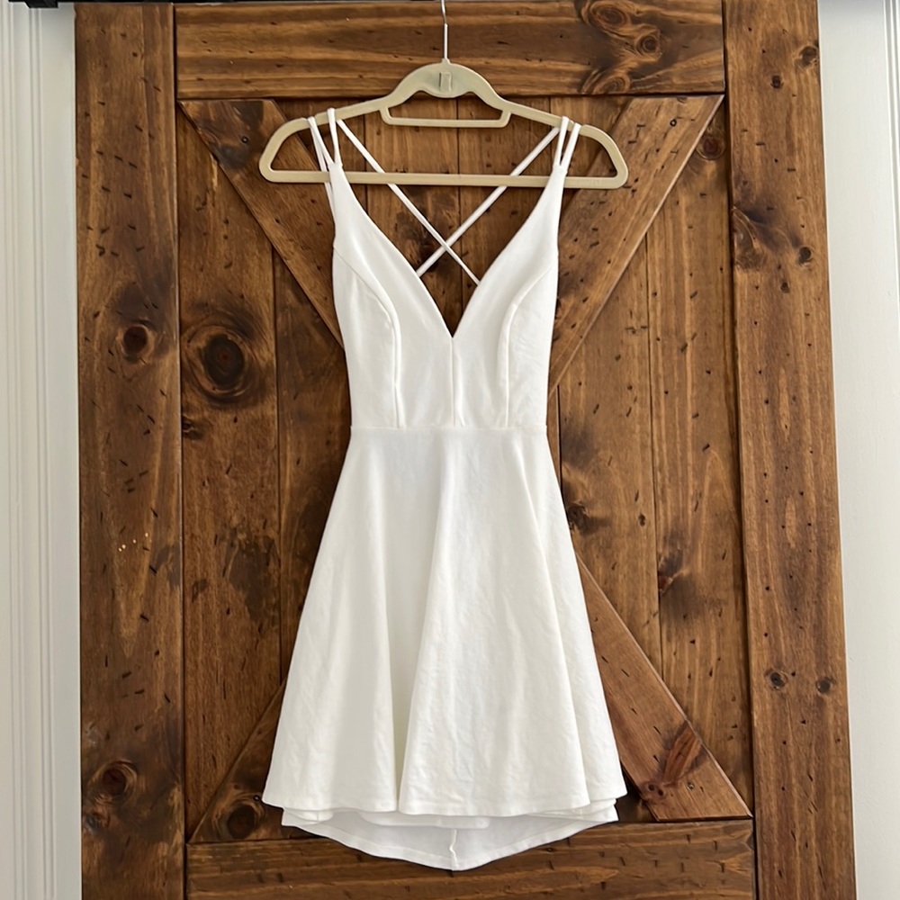 White mini skater dress with open back